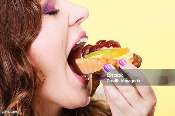 Closeup Woman Eating Fruit Cake Sweet Food Stock Photo - Download Image Now - Adult, Beautiful People, Beauty