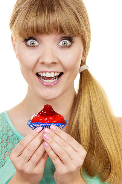 istock Woman holds cake strawberry cupcake 639486932