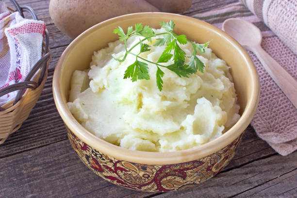 istock Mashed potatoes in ceramic bowl on wooden table 639489598