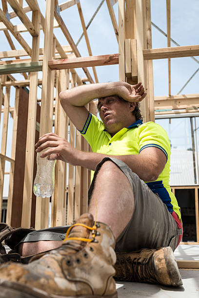 istock Young worker drinking water  on a building site. 639491174
