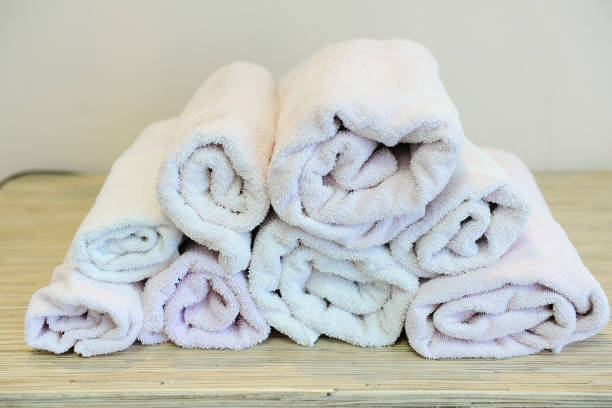 istock Stack of bath towels on light wooden background 639491348
