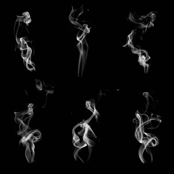 Photo of Collection of smoke patterns isolated on black