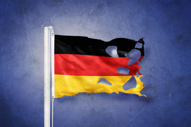 istock Torn flag of Germany flying against grunge background 639492202
