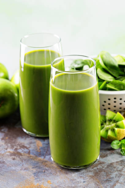 istock Green juice in tall glasses 639492438