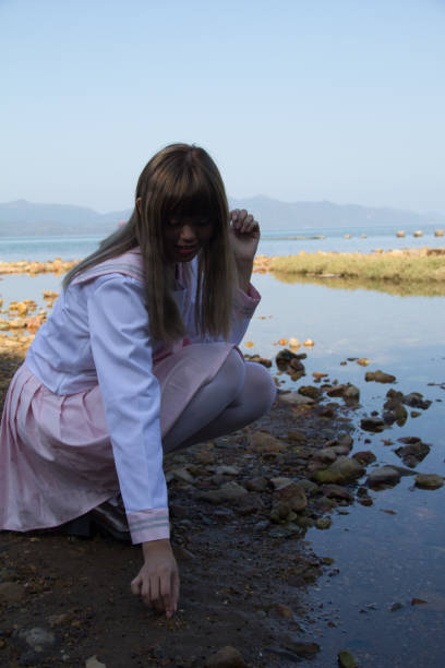 istock high school girl on sea side 639492558