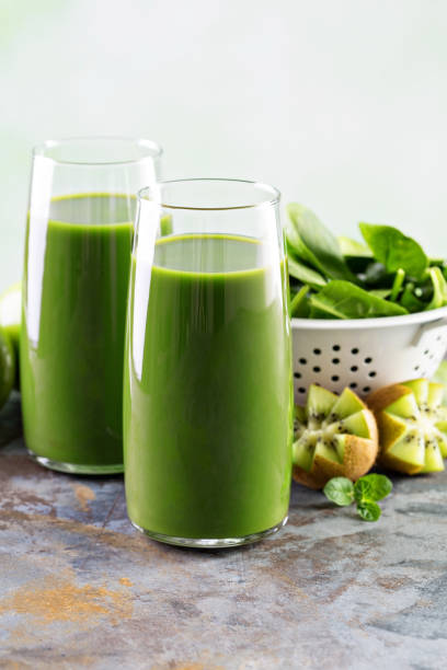 istock Green juice in tall glasses 639493516