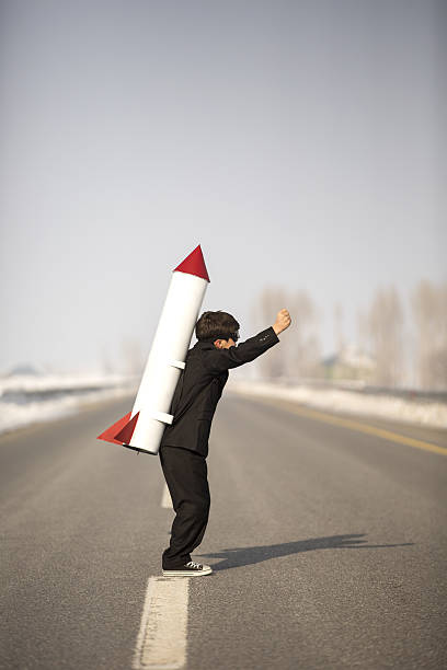 istock Young Business Boy Wearing Rocket 639495412