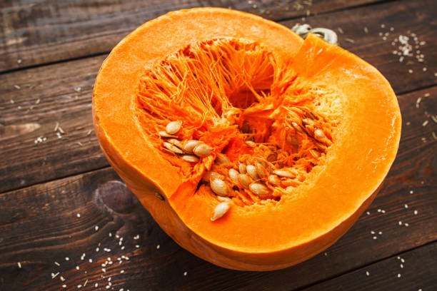 istock Fresh round pumpkin half cutaway closeup 639496556