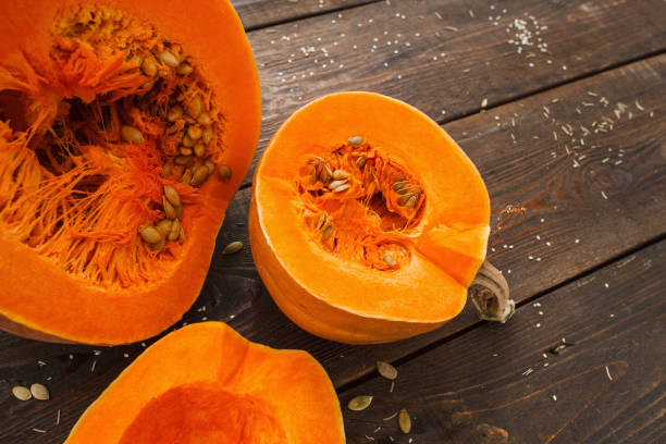 istock Several cut pumpkins on wood closeup 639496664