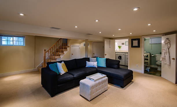 Modern Basement interior Interior of modern renovated lover floor basement common room in private city  residence. common room stock pictures, royalty-free photos & images