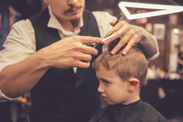 istock Kid at the barber shop 639499614