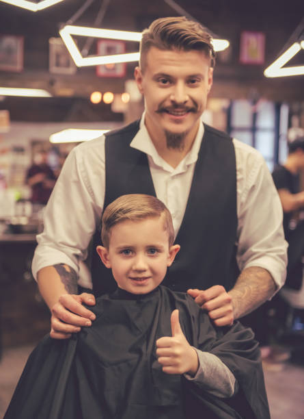 istock Kid at the barber shop 639499808