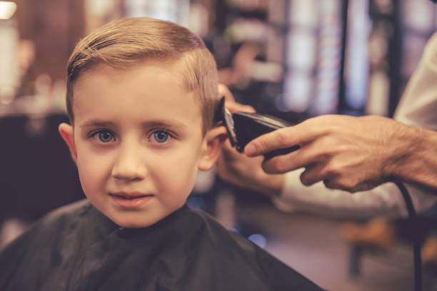 istock Kid at the barber shop 639500946