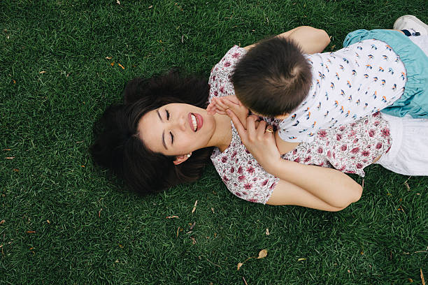 istock Mother and son having fun together in a park 639501056