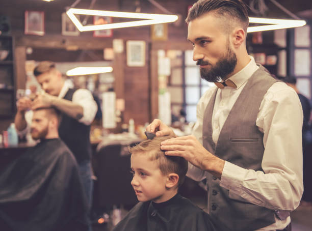 istock Kid at the barber shop 639501356