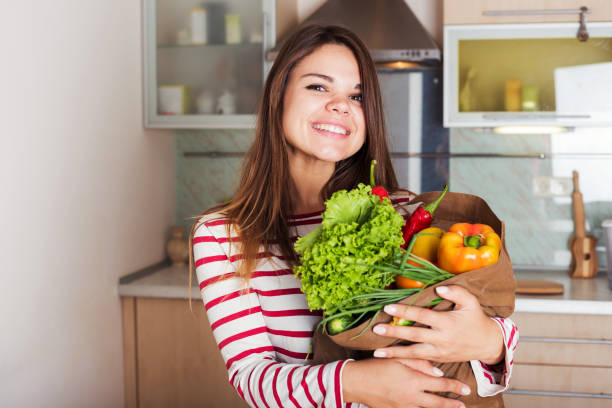 istock smiling housewife with  shopping bag 639501436