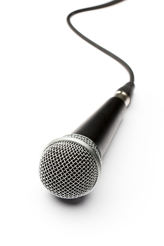 Front view of Microphone with cable lying on white background, 
