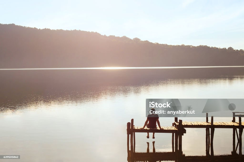 dreams and inspiration, happiness concept, enjoy life happy people, daydreamer, man enjoying beautiful view of the lake, inspiration in nature Lifestyles Stock Photo