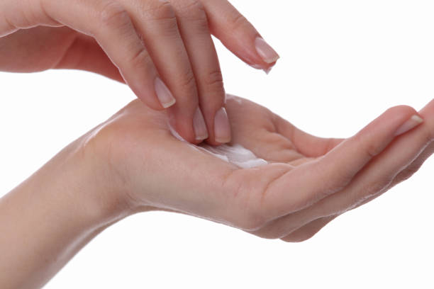istock Woman applying moisturizer cream on her hands 639507126