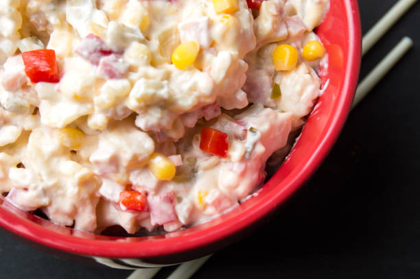 istock russian salad in a red bowl with chopsticks 639508926