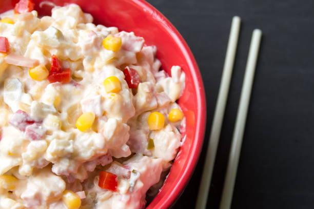 istock russian salad in a red bowl with chopsticks 639509118