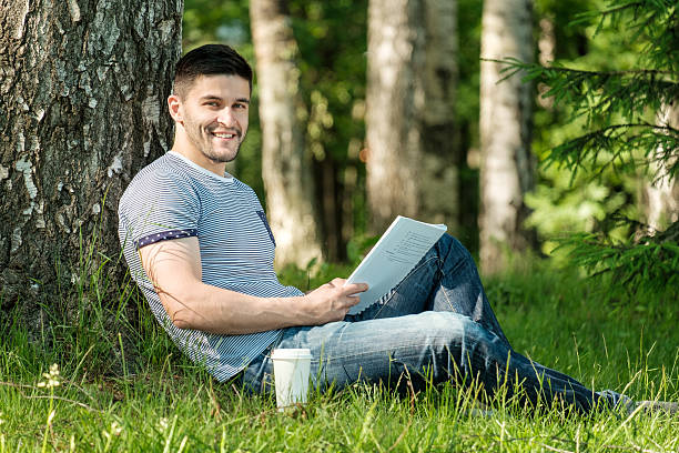 istock Young man in city park 639511070