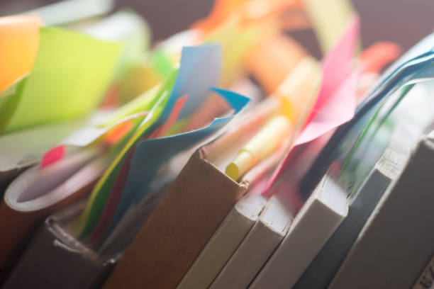 istock books and notebooks with multicolored stickers 639511334