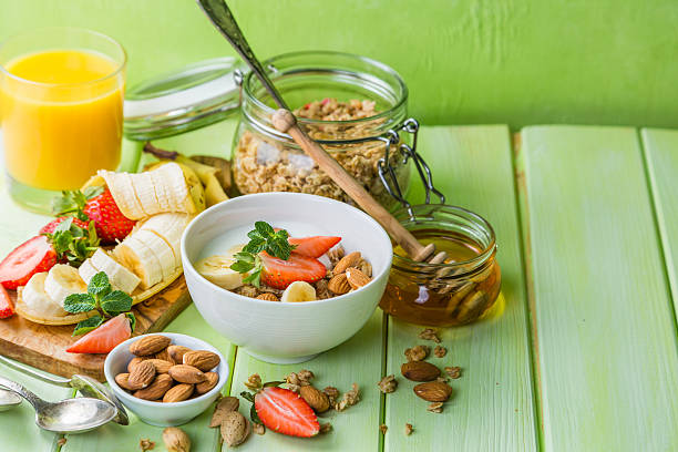istock Breakfast - strawberry and banana muesli with yogurt 639516242