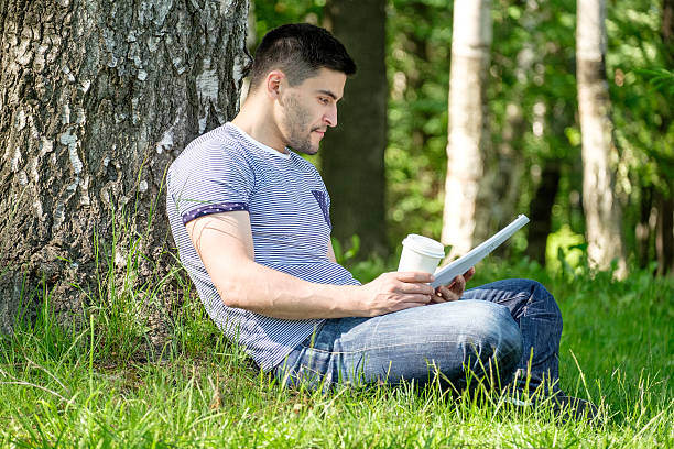 istock Young man in city park 639516704