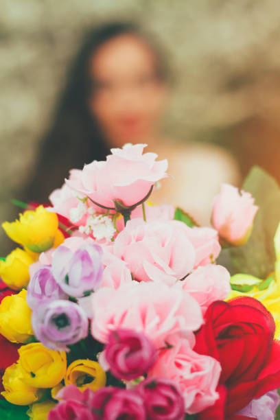 istock woman holding wedding bouquet 639517260