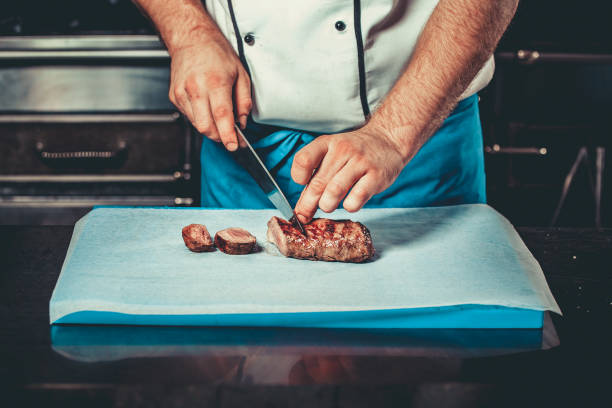 istock Busy chef at work in the restaurant kitchen 639518634