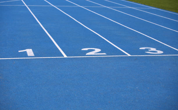 istock lanes of a blue athletic track 639519606