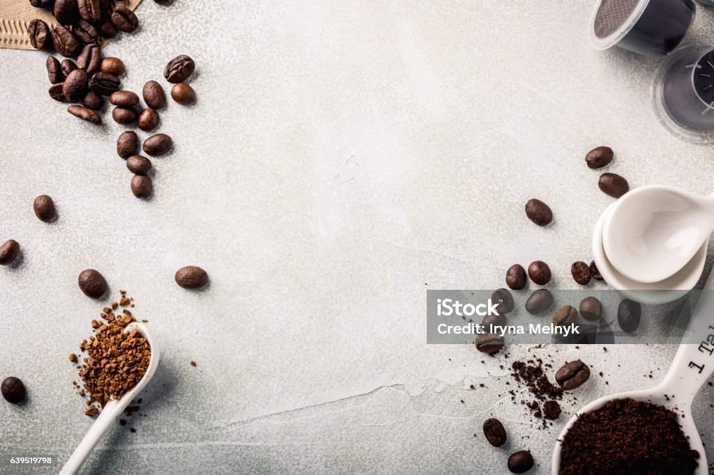 Background with assorted coffee Background with assorted coffee, coffee beans, ground and instant, pads and capsules, retro style toned, copy space, top view. Ground Coffee Stock Photo