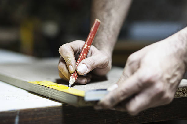 istock Drawing with construction pencil on wood and measuring tool 639521276