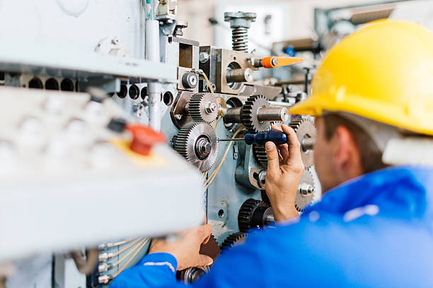 istock Maintenance engineer in factory installing the engine 639521394