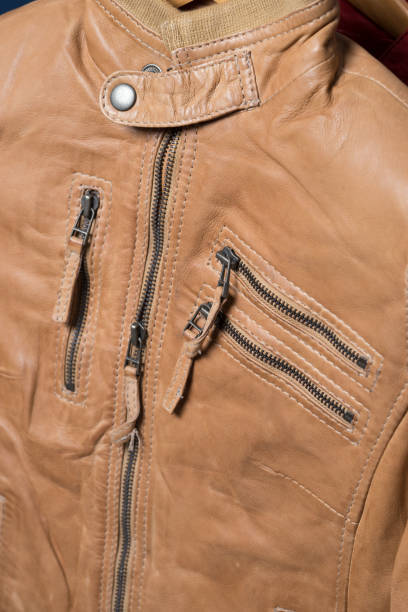 istock Light brown leather jacket. Beige color leather jacket on hanger 639521940