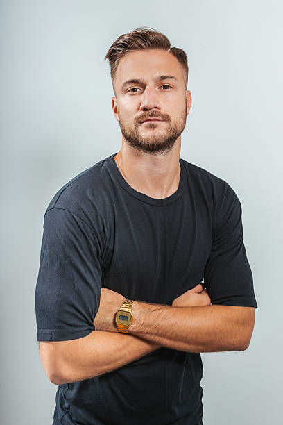 istock Cheerful European young man smiling in studio 639523210