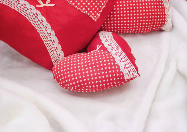 Handmade jewelry on Valentine's Day. Red heart pillow.