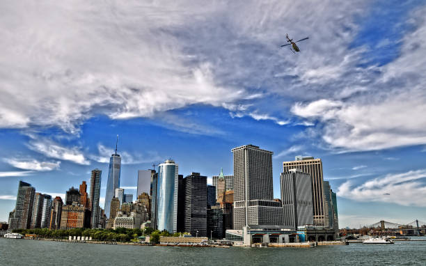 istock Lower Manhattan Skyline with flying helicopter. 639524564