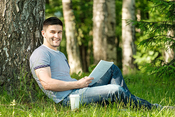 Young man in city park