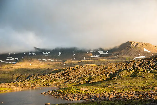cloudy sunny rocky landscape in iceland