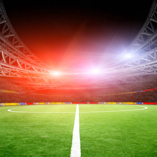 istock Soccer field with green grass and lights 639527852