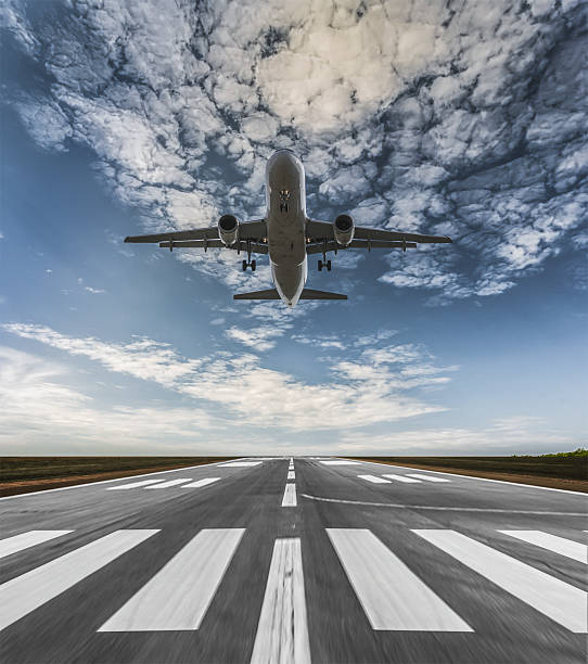 istock Airplane landing on a sunny day 639529142