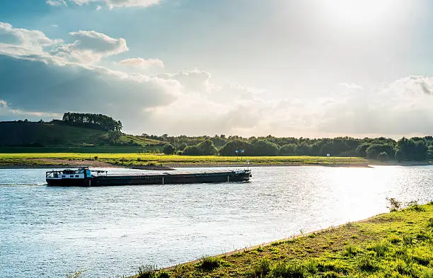 barge transports shipping on Rhine river, Duisburg, Germany