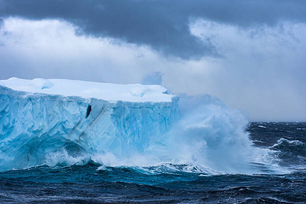 istock Massive Iceberg floating in Antarctica in a storm 639529370