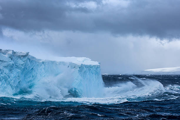 istock Massive Iceberg floating in Antarctica in a storm 639529496