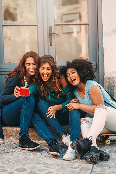 Selfie Friends taking a selfie in the city. three amigos stock pictures, royalty-free photos & images