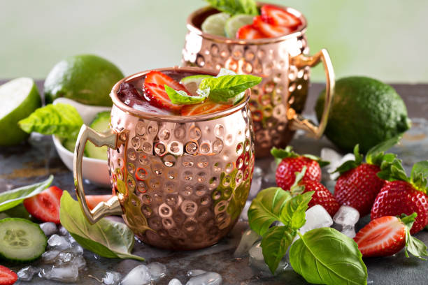 istock Moscow mule cocktail with lime and strawberry 639530758