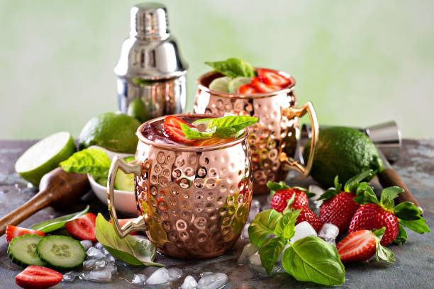 istock Moscow mule cocktail with lime and strawberry 639531176