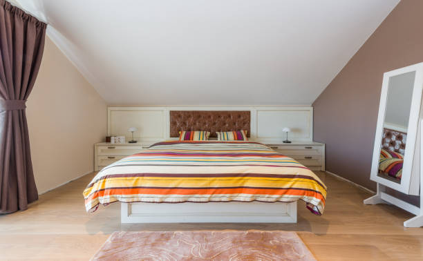istock Big bedroom in attic apartment 639532978